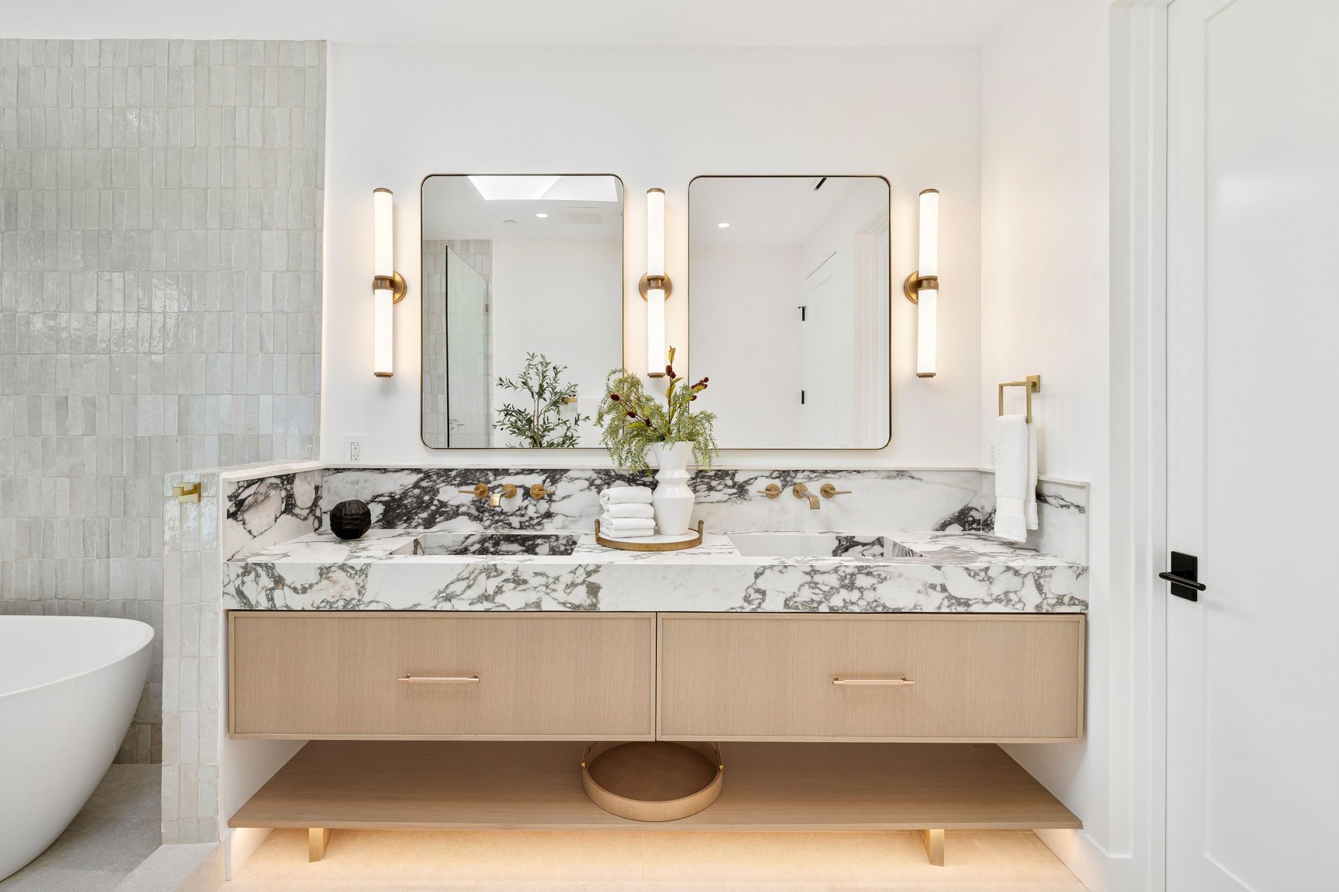 Restored marble bathroom vanity and mirror in an Upper West Side Manhattan apartment